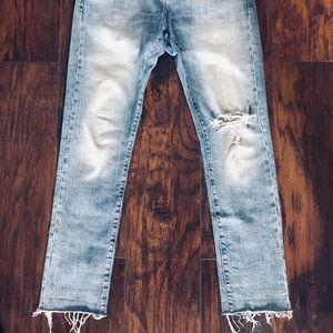 Men’s distressed Lucky brand jeans.
